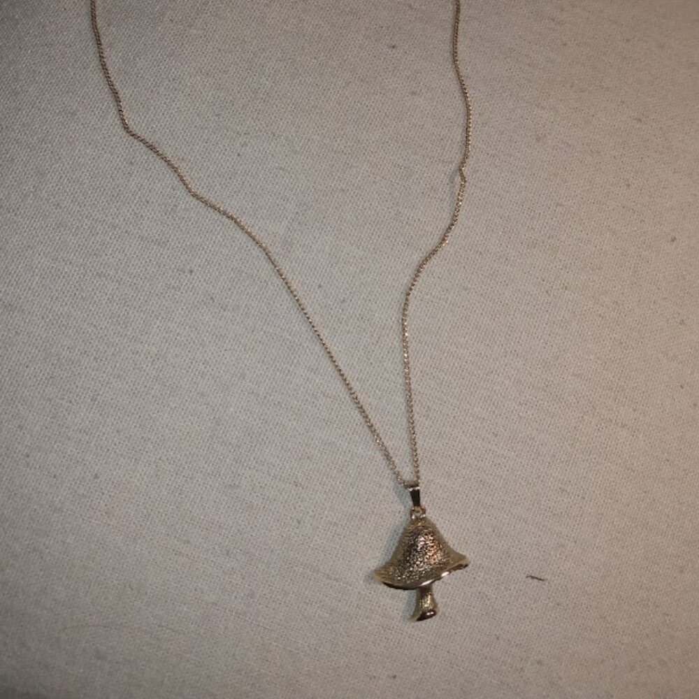 Marked Sarah: Gold tone mushroom pendant necklace.